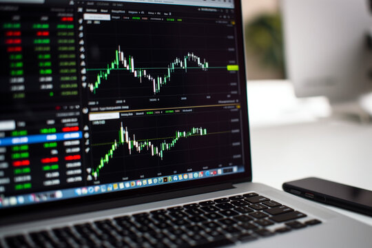 Financial stock market on a laptop screen. Stock market curve on screen. Investing in the stock market. Sotck exchange. Stock market training.