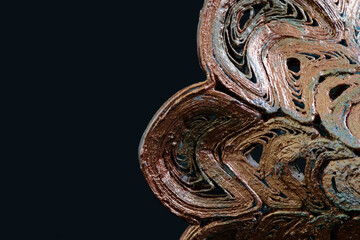 Abstract figure with the texture of a 3D printed model, painted copper color with oxidation spots....