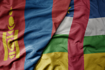 big waving national colorful flag of central african republic and national flag of mongolia.