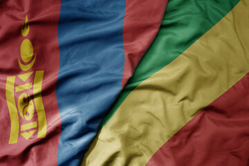 big waving national colorful flag of republic of the congo and national flag of mongolia.