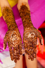 Bridal henna tattoo hands with open palms with Ganesha pattern design
