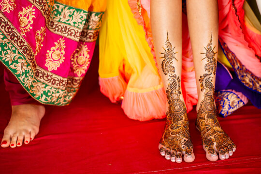 Feet of Indian bride with henna tattoo pattern
