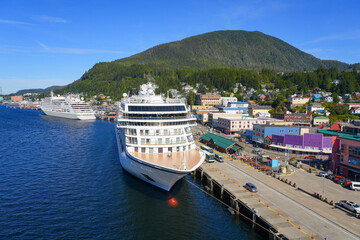 Cruise ship moored in downtown Ketchikan, the southernmost town in Alaska nestled in forest-covered...