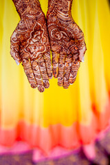 Indian bride with henna tattoo on hands