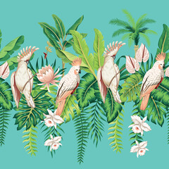 Tropical pink cockatoo parrots, green palm leaves, banana tree, pink lotus flower, orchid floral seamless pattern blue background. Exotic jungle wallpaper.