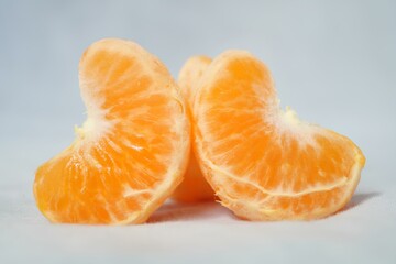 A close up of an orange with the top half cut off