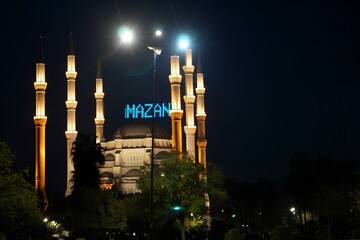 A large mosque with a blue sign