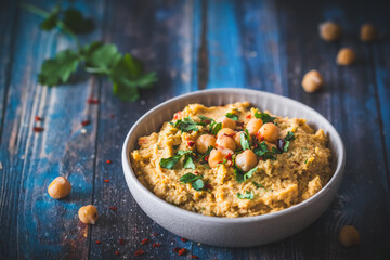 Hummus, chickpea puree with coriander in a bowl