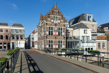 Gorinchem, the Netherlands. 27 February 2024. Typical houses with red and white shutters on the...