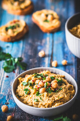 Hummus, chickpea puree with coriander in a bowl