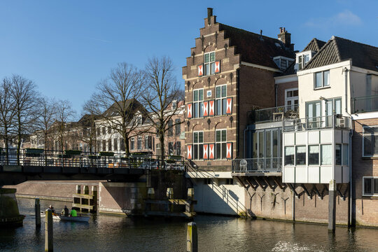 Gorinchem, the Netherlands. 27 February 2024. Typical houses with red and white shutters on the window in the fortified city Gorinchem along the bridge and canal Linge.