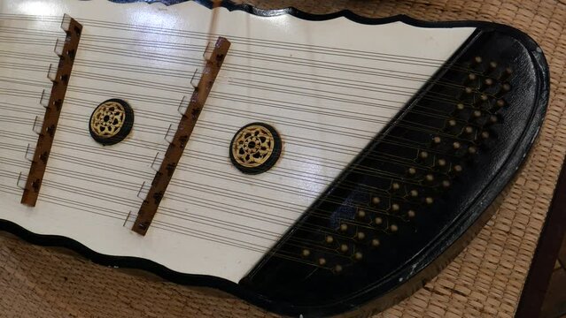 Playing Thai dulcimer