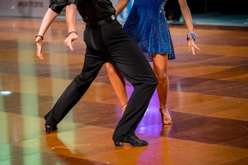 a couple dance a Latin dance. the legs of a dancing couple