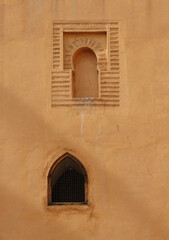 Fototapeta na wymiar The Gold City of Marrakech. Detail of facade and windows in the historic Medina. Morocco. UNESCO World Heritage.