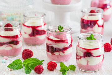 Fruity quark dessert with raspberries in small glasses
