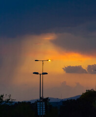 Naklejka premium Streetlamp Amidst Approaching Storm