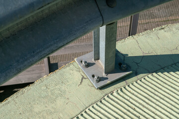 guard rail on the road, construction detail of the parapet, to avoid lane jumps or overturning. anti-corrosion galvanized steel material, structure and detail of the ground fixing with certified bolts