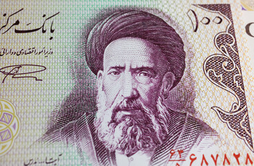 Portrait of iranian cleric and revolution supporter Hassan Modarres on 100 Iran Rial currency banknote  (focus on center)