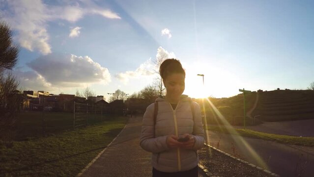 Young woman enjoying a walk at park