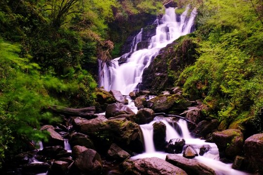 torc waterfall in the forest long exposure landscape