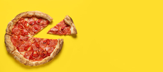 Delicious pepperoni pizza on yellow background with space for text, top view