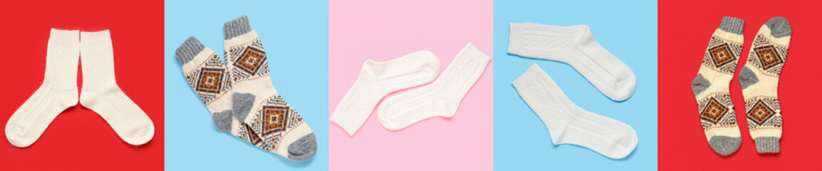 Set of different warm knitted socks on color background, top view