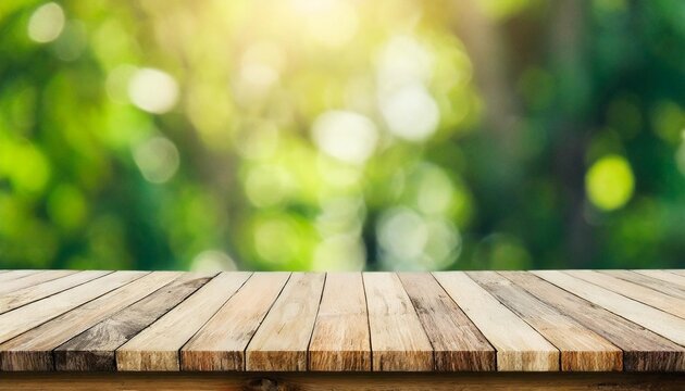 empty wooden table top and abstract blurred light bokeh and blur background of garden trees in sunlight product display template with copy space