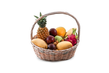 basket with tropical fruits isolated on white