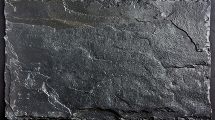 A dark black slate background or texture, offering a simple yet impactful visual element suitable for various applications