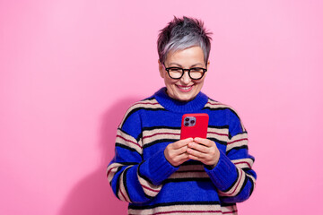 Photo portrait of lovely senior lady instagram twitter facebook telegram wear trendy blue striped garment isolated on pink color background