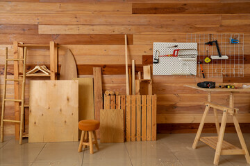 Interior of carpenter's workshop with wooden products