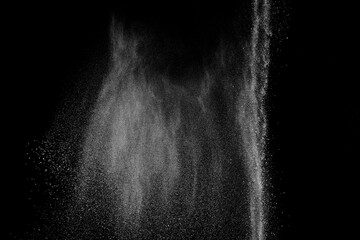 Abstract white dust on black background. Light smoke texture. Powder explosion. Splash water...