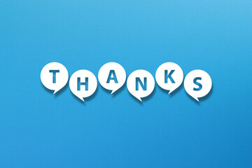 Thank you message with speech bubbles on blue background 