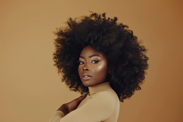 A beautiful black woman with an afro hairstyle poses in front of the camera