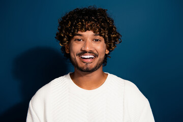 Portrait of handsome curly hair mexican boyfriend in white pullover toothy smiling good mood...