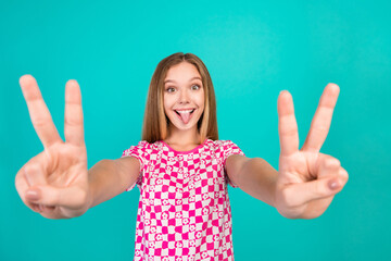 Photo portrait of nice teen woman tongue out show double v-sign dressed stylish pink print outfit...