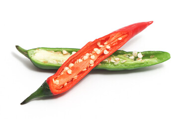 Half slice red and green hot chili pepper isolated on white background clipping path