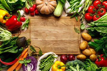 Vegetables background. Various vegetables on kitchen table. Clean eating, healthy food concept, flat lay, top down view - 763561293