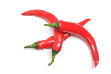 Keuken spatwand met foto Three red hot chili pepper top view isolated on white background clipping path © dwiangga