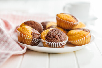 Close Up of a Muffina on plate on a white Table