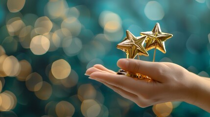A hand gesture holding five golden star awards, representing success in business or the recognition of personal talent - obrazy, fototapety, plakaty