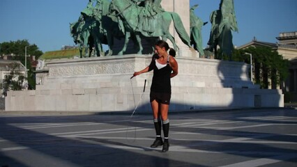 Professional jump rope tricks in 19th century square