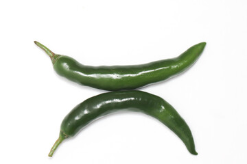Two green hot chili pepper top view isolated on white background clipping path