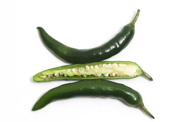 Half sliced green hot chili pepper top view isolated on white background clipping path