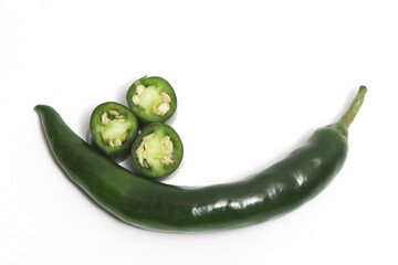 Tthree sliced green hot chili pepper top view isolated on white background clipping path