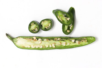Tthree sliced green hot chili pepper top view isolated on white background clipping path