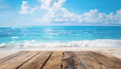 Fotobehang Wood table top on blurred blue sea and white sand beach background © Oleksiy