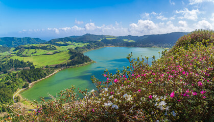 Gaze over the vibrant greens of Furnas Lake from Miradouro do Pico do Ferro, a stunning testament to São Miguel volcanic splendor and rich flora. - 763571832