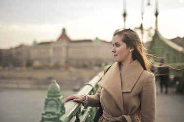 portrait of a young woman on a bridge - 763573073