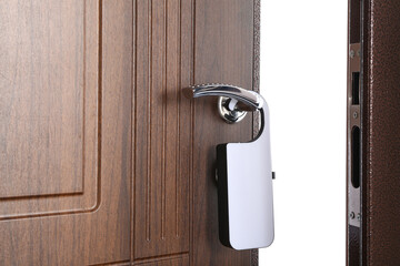 Opened door with door hanger in hotel room